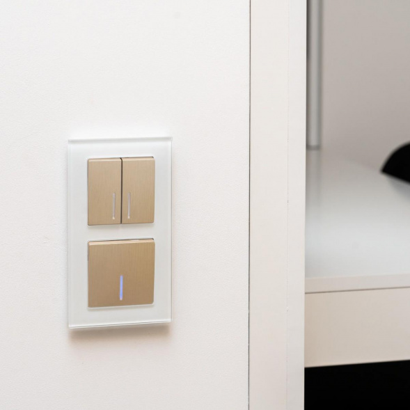 Выключатель Werkel двухклавишный проходной с подсветкой шампань рифленый W1122110 4690389160257